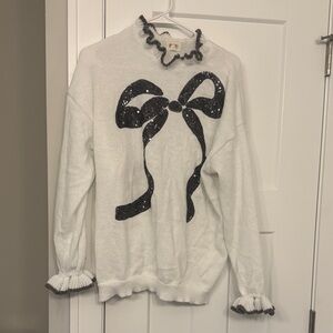 BiBi White Sweater with Black Bow Accent